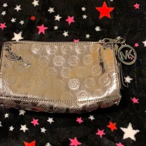 Michael Kors Bags - Michael Kors silver metallic pouch Michael Kors Bags - Michael Kors silver metallic pouch